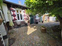 Bild (e59390b0488131ac0c5037adaf6a4c65): Reihenendhaus und Anbau mit historischem Charme, Garage, Innenhof und liebevoll angelegtem Garten